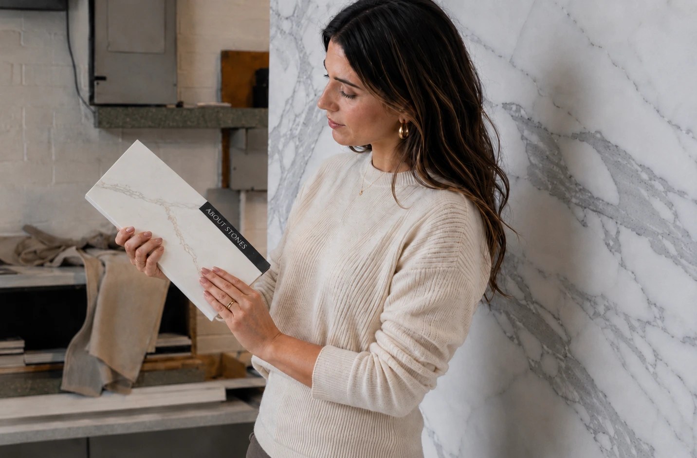 Woman choosing an About Stones surface sample